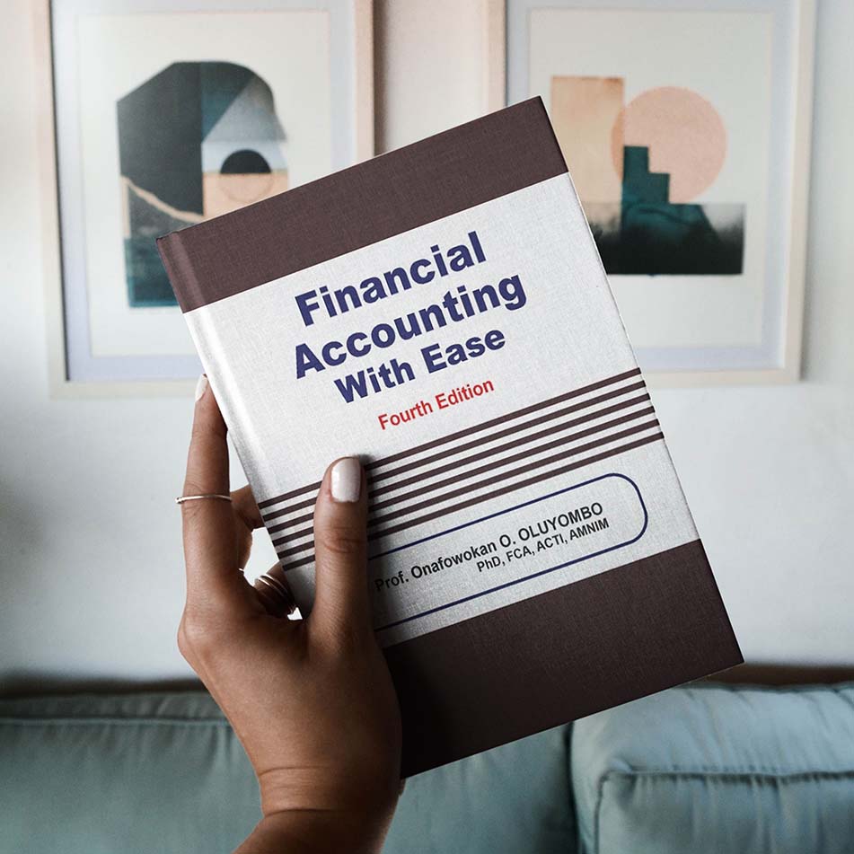 Financial Accounting With Ease textbook held in hand